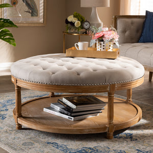 Baxton Studio Ambroise French Provincial Beige Linen Fabric Upholstered And White-Washed Oak Wood Button-Tufted Cocktail Ottoman With Shelf